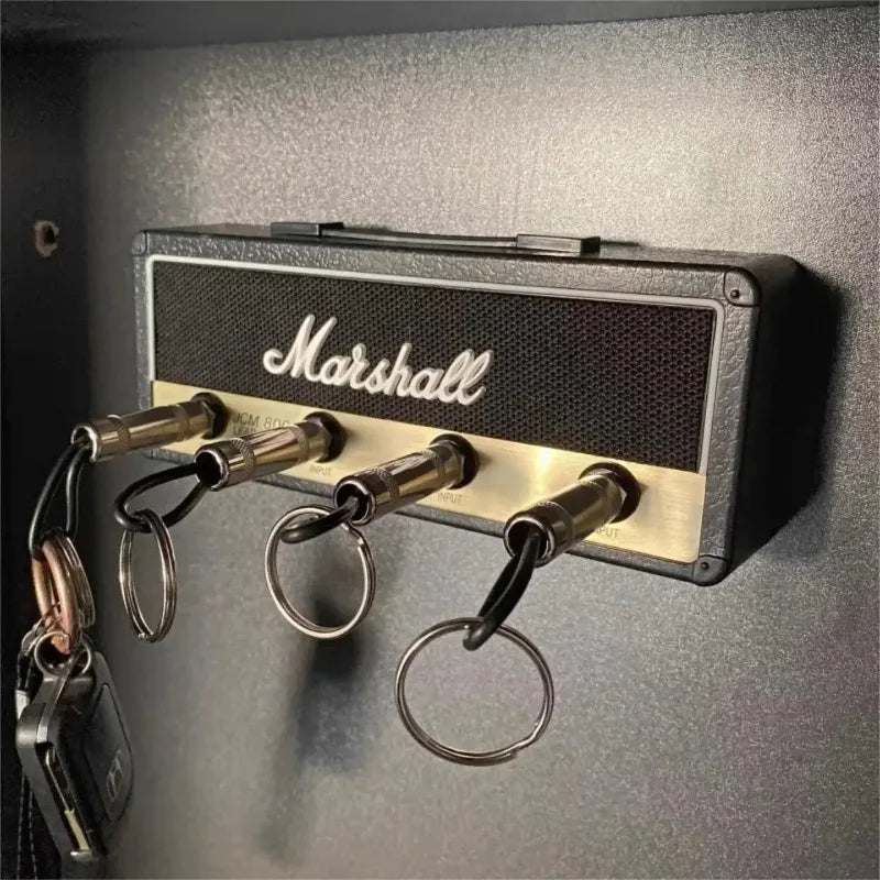 Marshall amplifier-style key holder on a wall with keys attached.